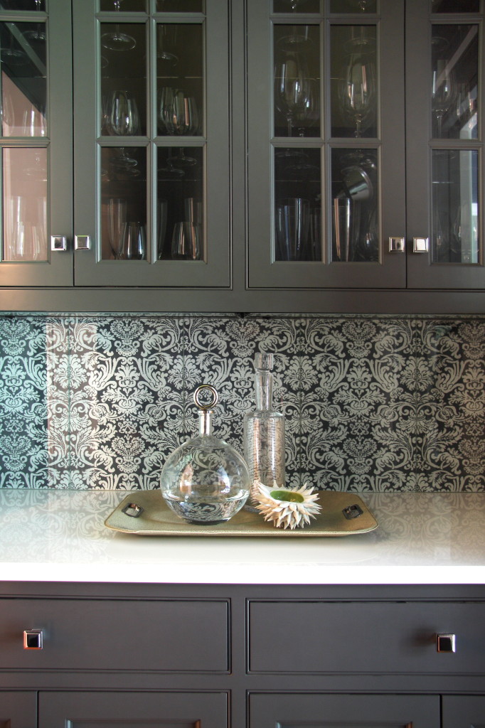 A collaboration with True North Cabinets, this butler's pantry features an eye catching back splash.
