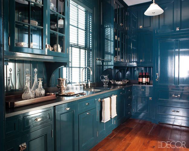 Miles Redd designed this pantry with gorgeous blue lacquer cabinets.